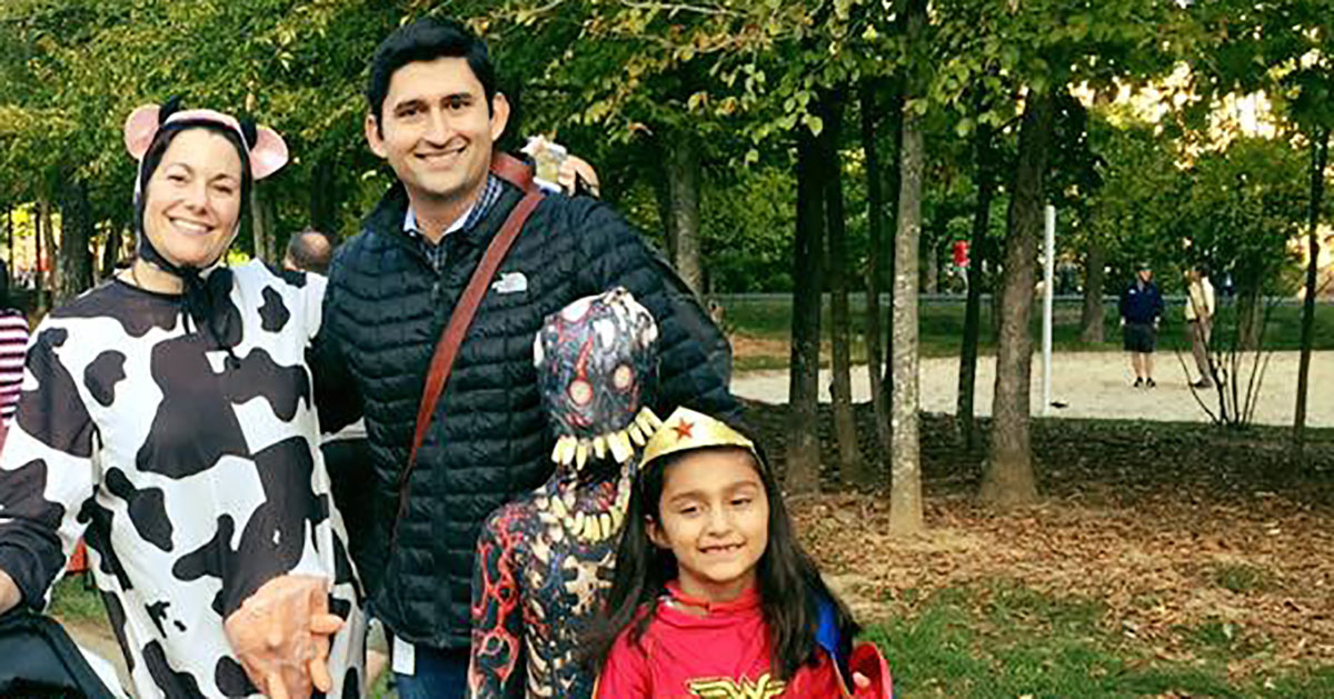 Oz Parvaiz at Capital One with his family and old college friend